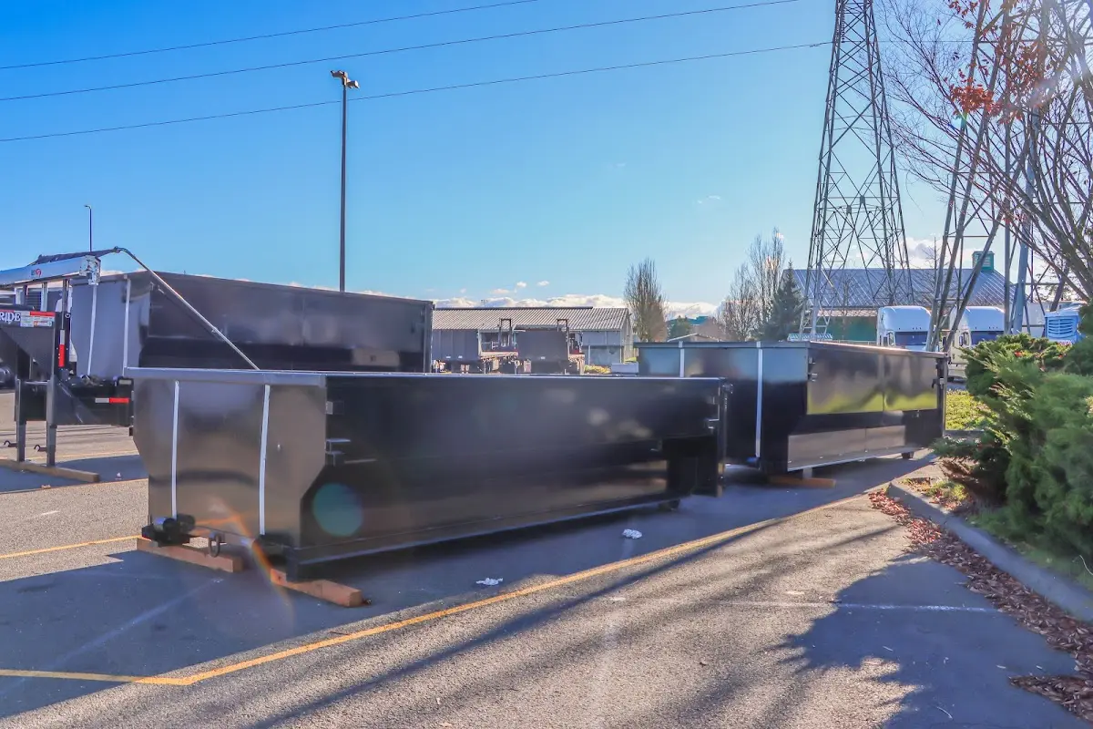 Roll-off dumpster ready for waste disposal at job site for 2 Yard Dumpster Rental in Harvey